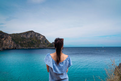 Girl admiring a seascape on the cilento coast