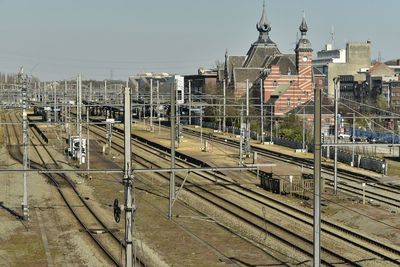 High angle view of train in city against sky