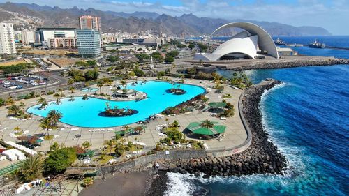 High angle view of swimming pool in city