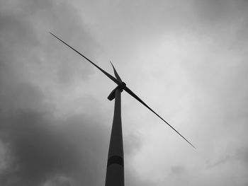 Low angle view of windmill against sky