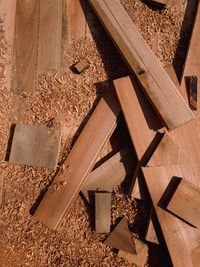 High angle view of stack of wooden structure in forest