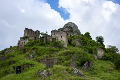 Low angle view of old ruins against sky