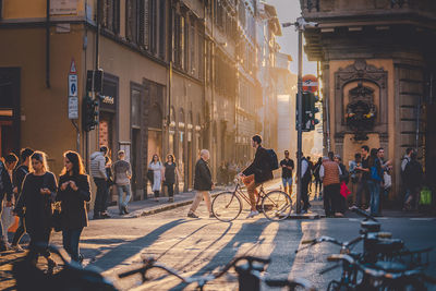 People on street in city during sunset