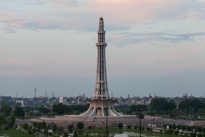 Minar-e-pakistan against sky during sunset in city
