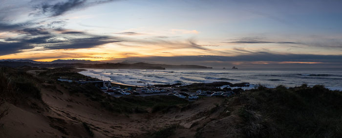 High angle view of beach against sky during sunset