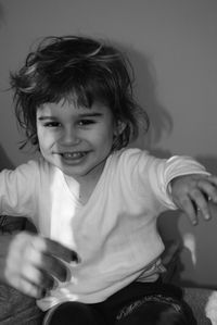 Girl sitting with mother at home