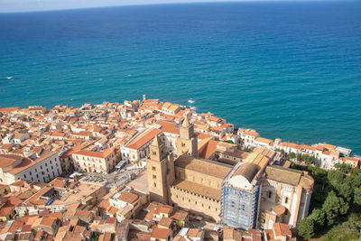 High angle view of townscape by sea