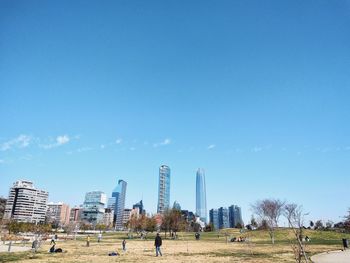 Panoramic view of city against blue sky