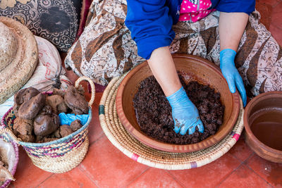 High angle view of woman working in basket