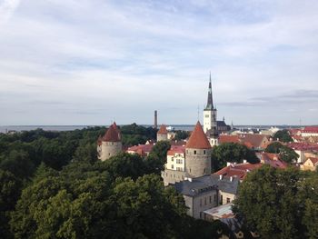 View of town against cloudy sky