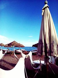 Panoramic view of beach against clear blue sky