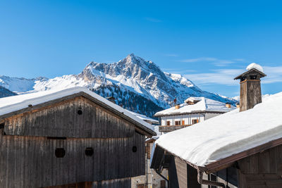 Winter magic. the ancient wooden houses of sauris di sopra. italy