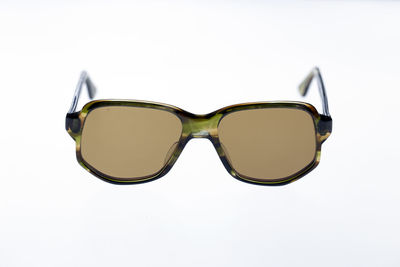 Close-up of sunglasses against white background