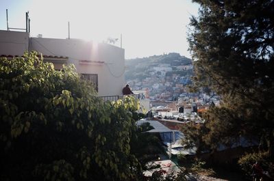 View of buildings in city against clear sky