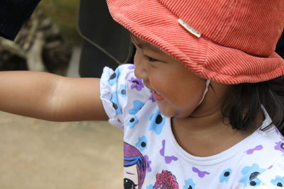 Portrait of cute girl wearing hat