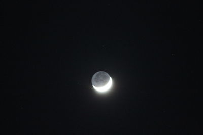 Low angle view of moon against sky at night