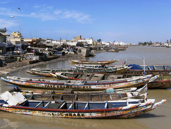 Panoramic view of city by sea against sky