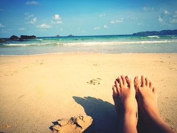 Low section of legs on beach