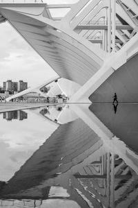 Reflection of bridge and buildings in city