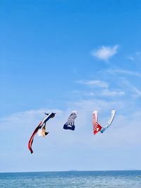 Low angle view of kite flying against sky