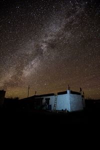 Low angle view of building against sky at night