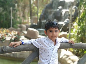 Portrait of cute boy with arms outstretched