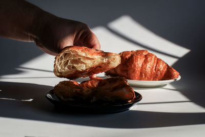 Close-up of person preparing food on table