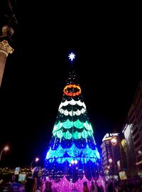 Low angle view of illuminated building at night