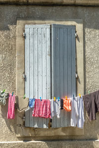 Clothes drying against closed door of building