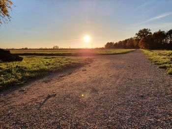 Scenic view of field against sky during sunset