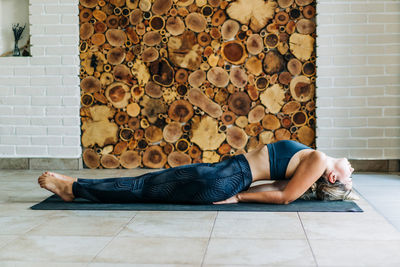 Young woman exercising at home