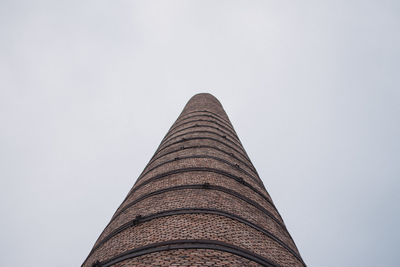 Low angle view of factory against clear sky