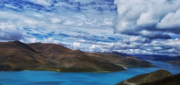 Scenic view of sea against cloudy sky