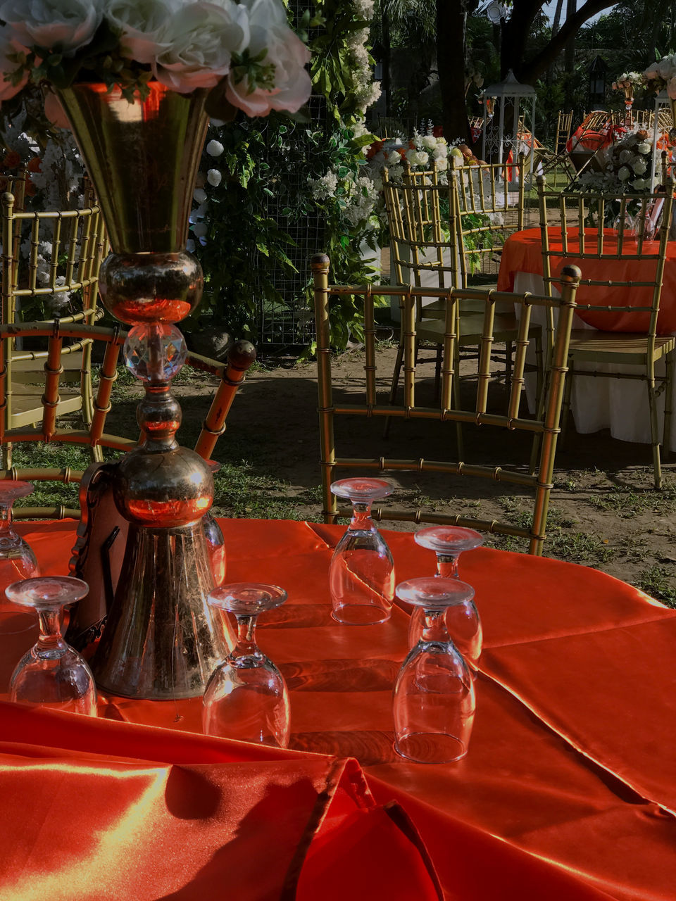 red, table, plant, no people, nature, flower, seat, food and drink, centrepiece, chair, outdoors, glass, wine glass