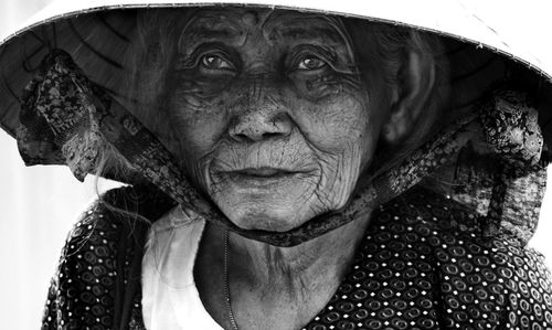 Close-up portrait of woman with hat