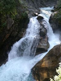 Scenic view of waterfall in forest