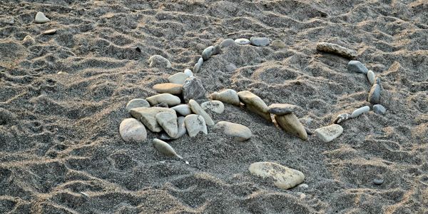 High angle view of pebbles on beach