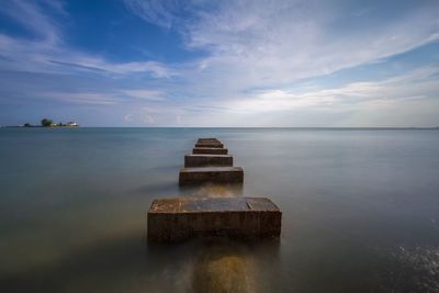 Pier on sea against sky