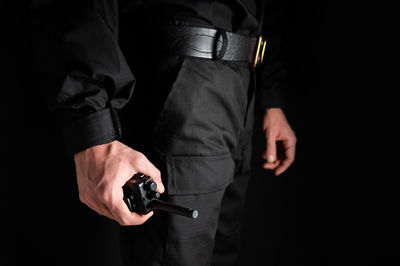 Midsection of man holding hands