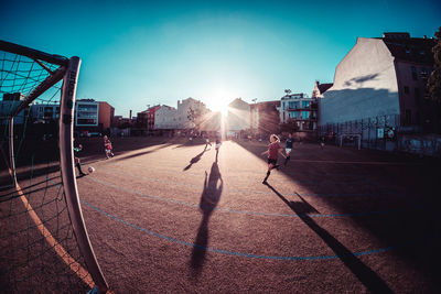 Sun shining over city street