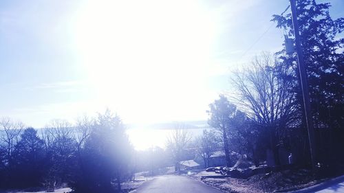 Snow covered landscape against sky