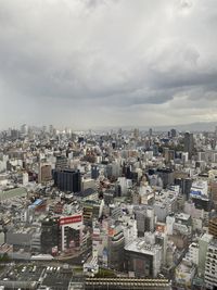 High angle view of city buildings against sky