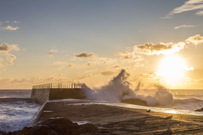 Scenic view of sea against sky during sunset