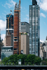 Modern buildings in city against sky