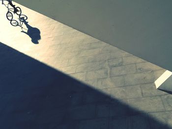 Shadow of people on tiled floor