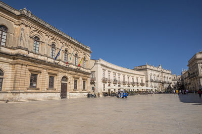 Historic buildings with beautiful facades in piazza duomo in ortigia