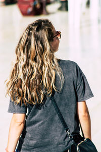 Rear view of woman standing in traditional clothing