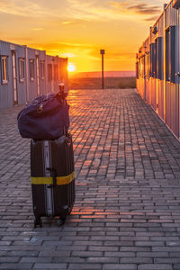 View of footpath against sky during sunset