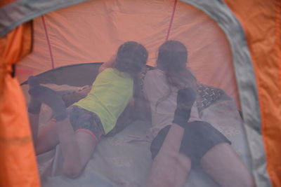 High angle view of people relaxing on floor