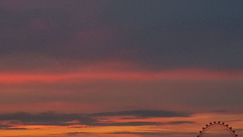 Scenic view of dramatic sky during sunset